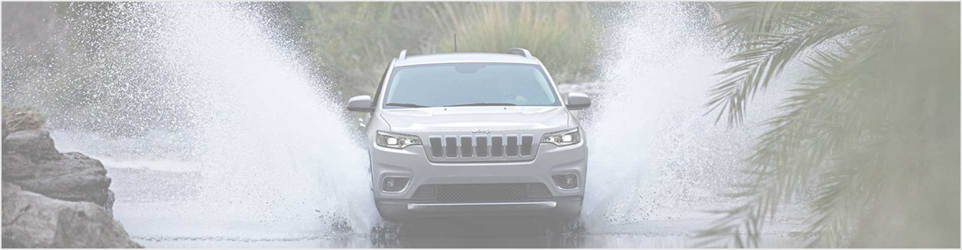 CDJR-NoMonthly Jeep driving through the water with a white overlay
