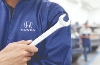 man holding wrench