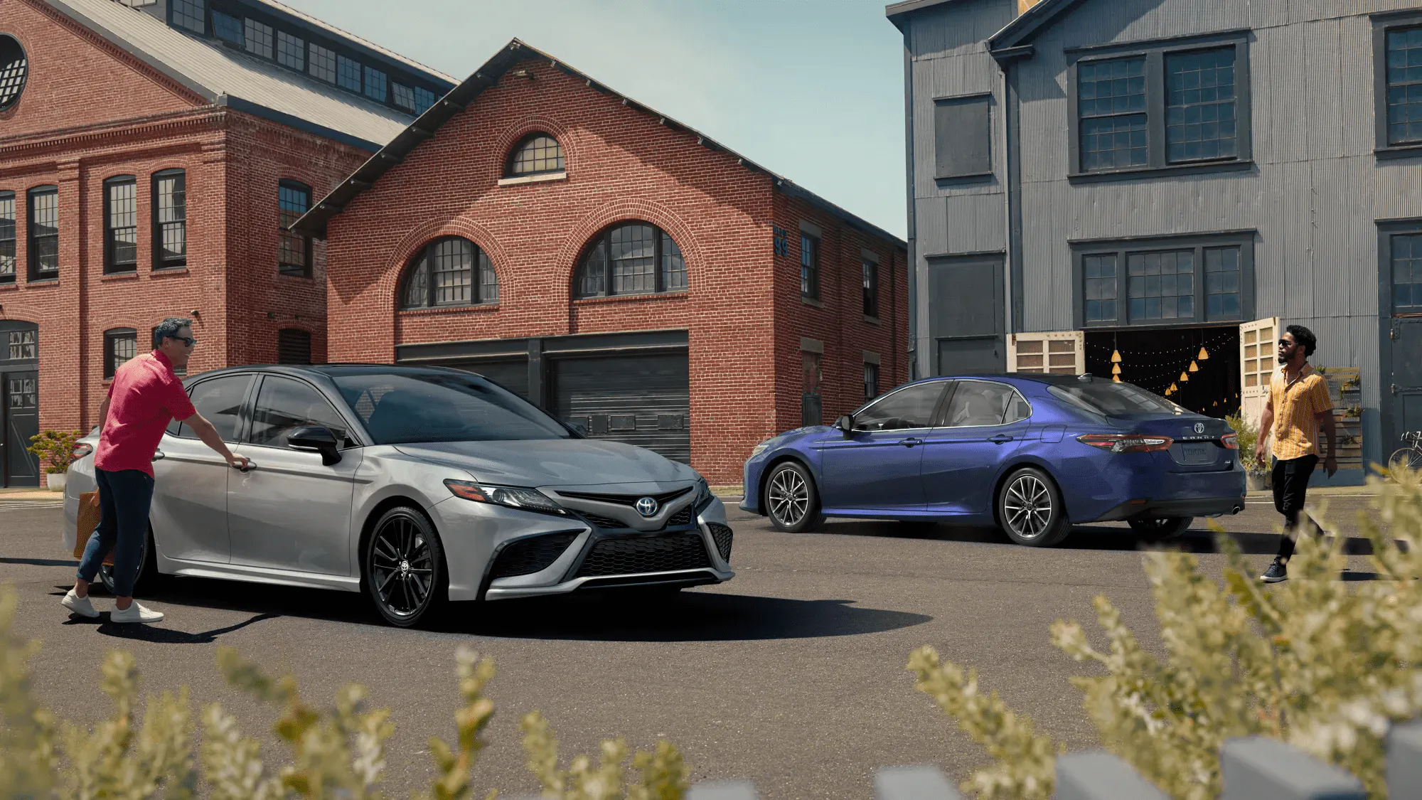 Man entering silver Toyota