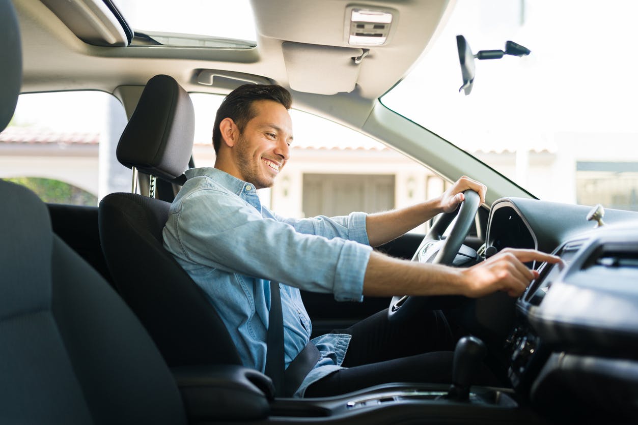 male enjoying his new car