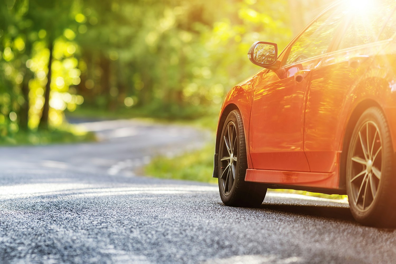 Red,Car,On,Asphalt,Road,In,Summer GET YOUR CAR READY FOR WARMER WEATHER.