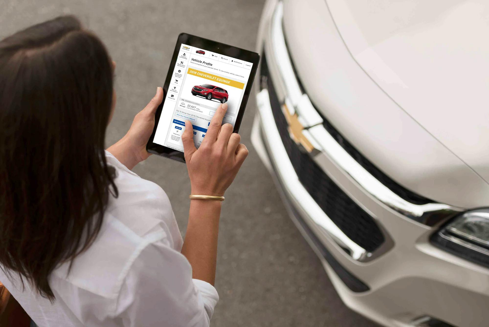 woman shopping for a car on an ipad