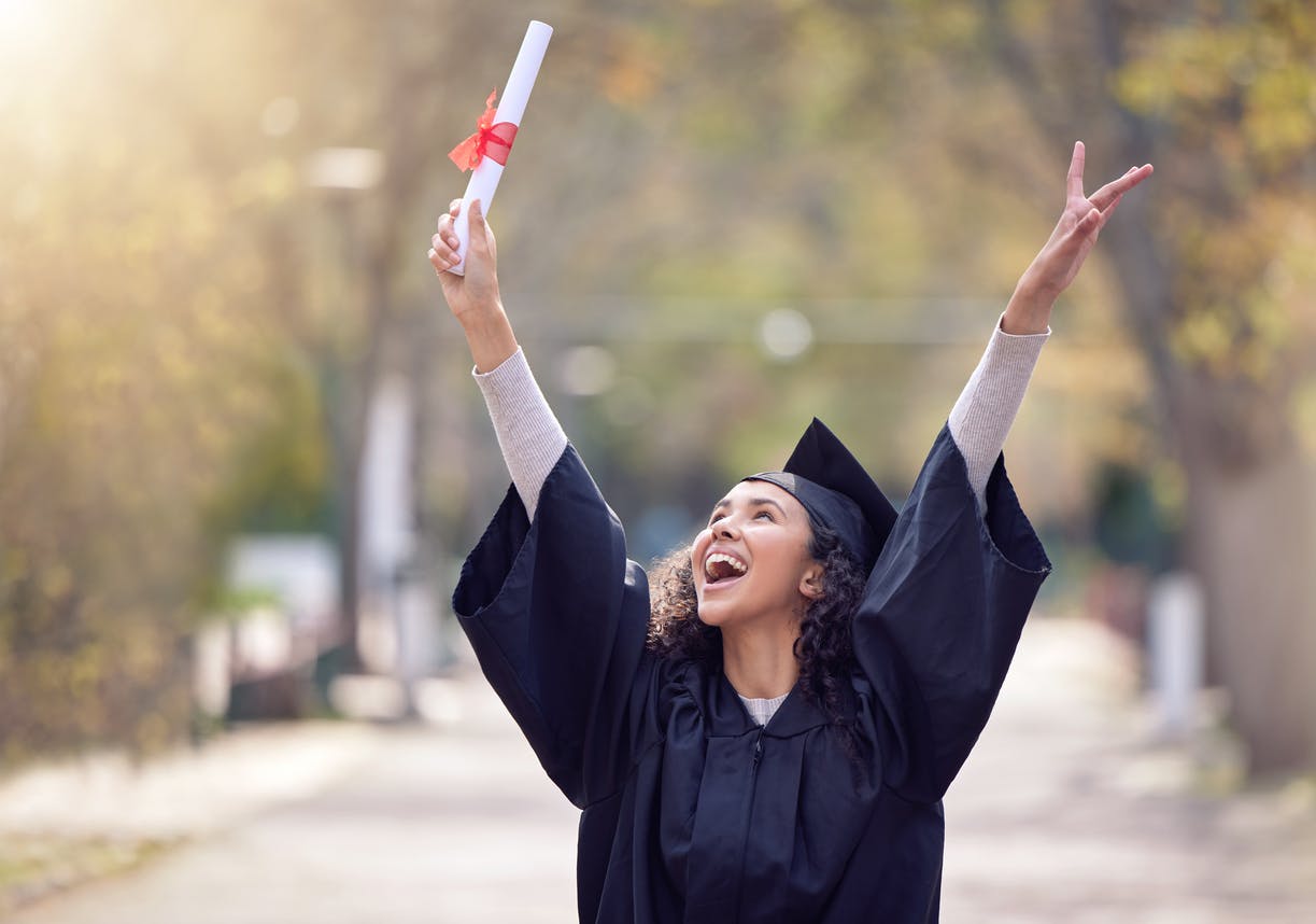 Shot of a young woman cheering on graduation day