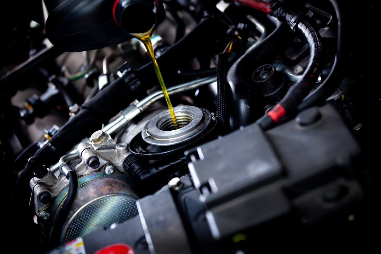 engine oil poured into a vehicle