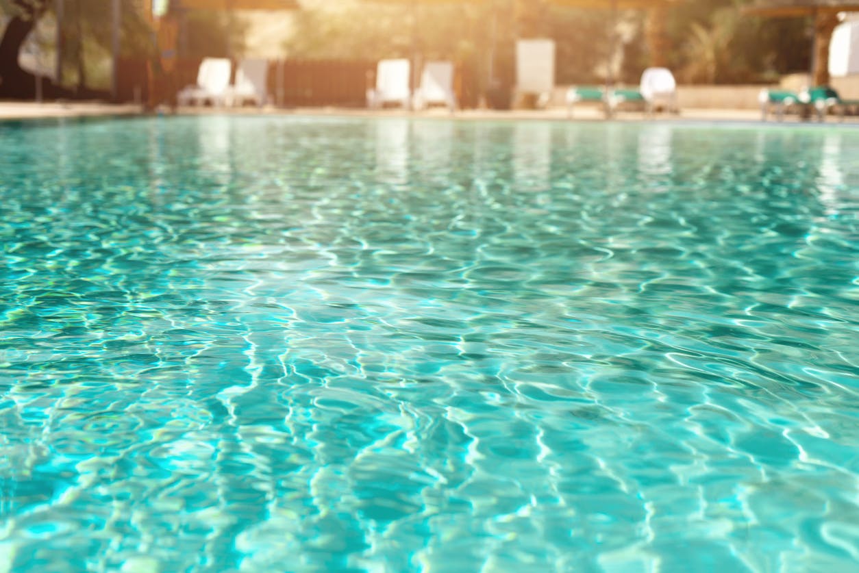 near shot of the surface of water in a swimming pool