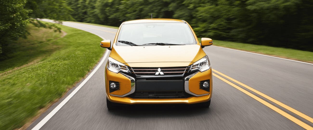 yellow 2022-mitsubishi-mirage-front-view driving