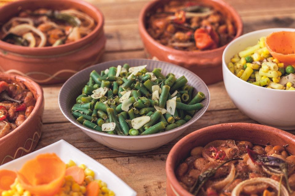 Thanksgiving side dishes. Green beans with garlic, corn, beam, sweet potatoes.