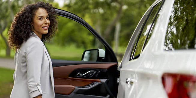 woman opening chevy door