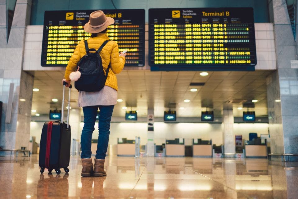 a young woman takes a flight on her vactaion