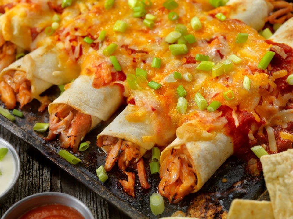 chicken enchiladas with cheese and salsa