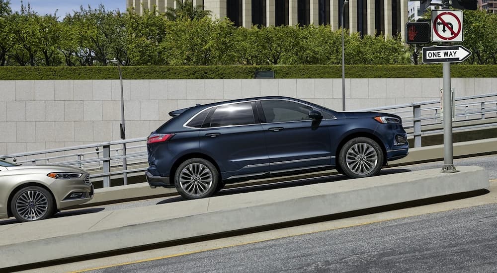 A blue 2022 Ford Edge Titanium Elite is shown from the side.