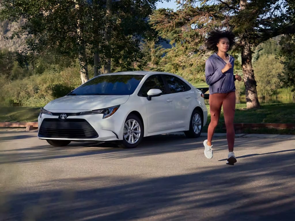 2023 white corolla with girl 2023 white corolla with girl