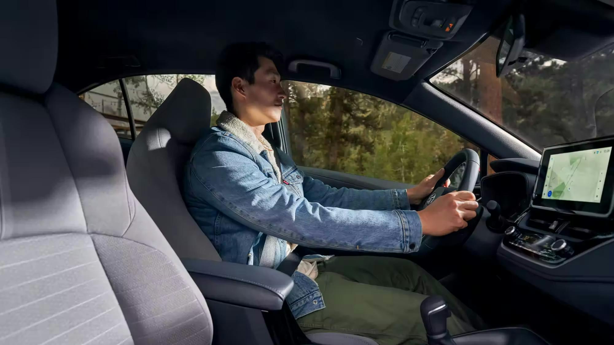 man driving corolla man driving corolla