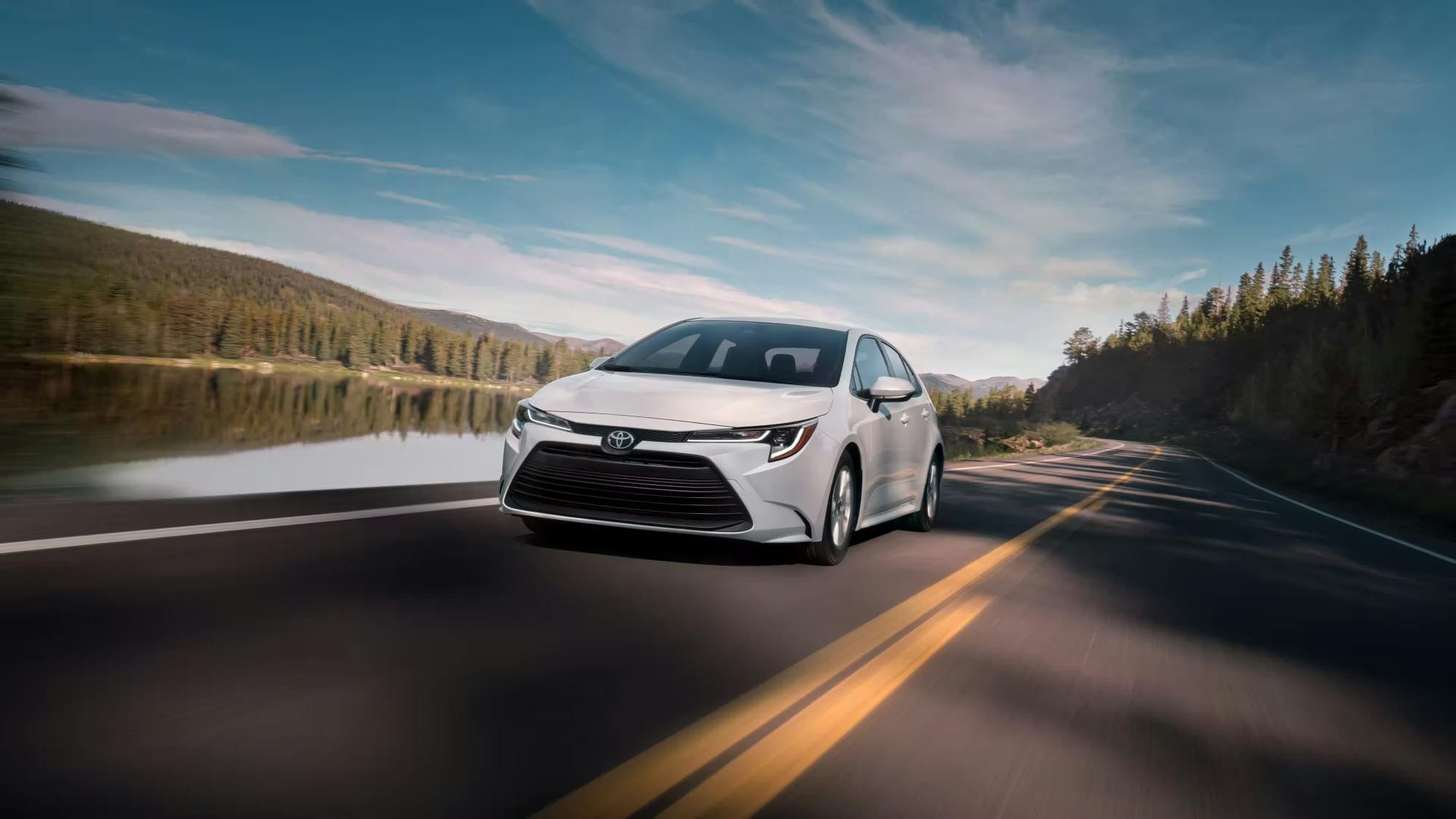 white corolla on an open road white corolla on an open road