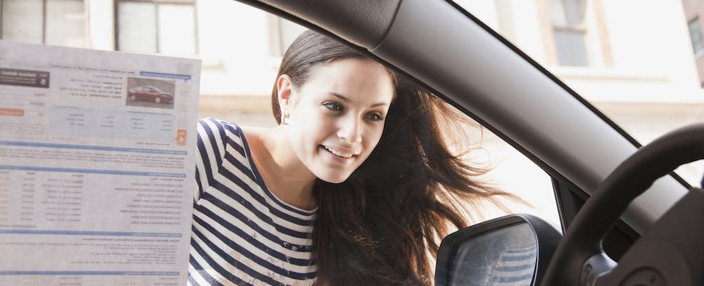 woman looking inside a vehicle, car shopping, how to pick a car