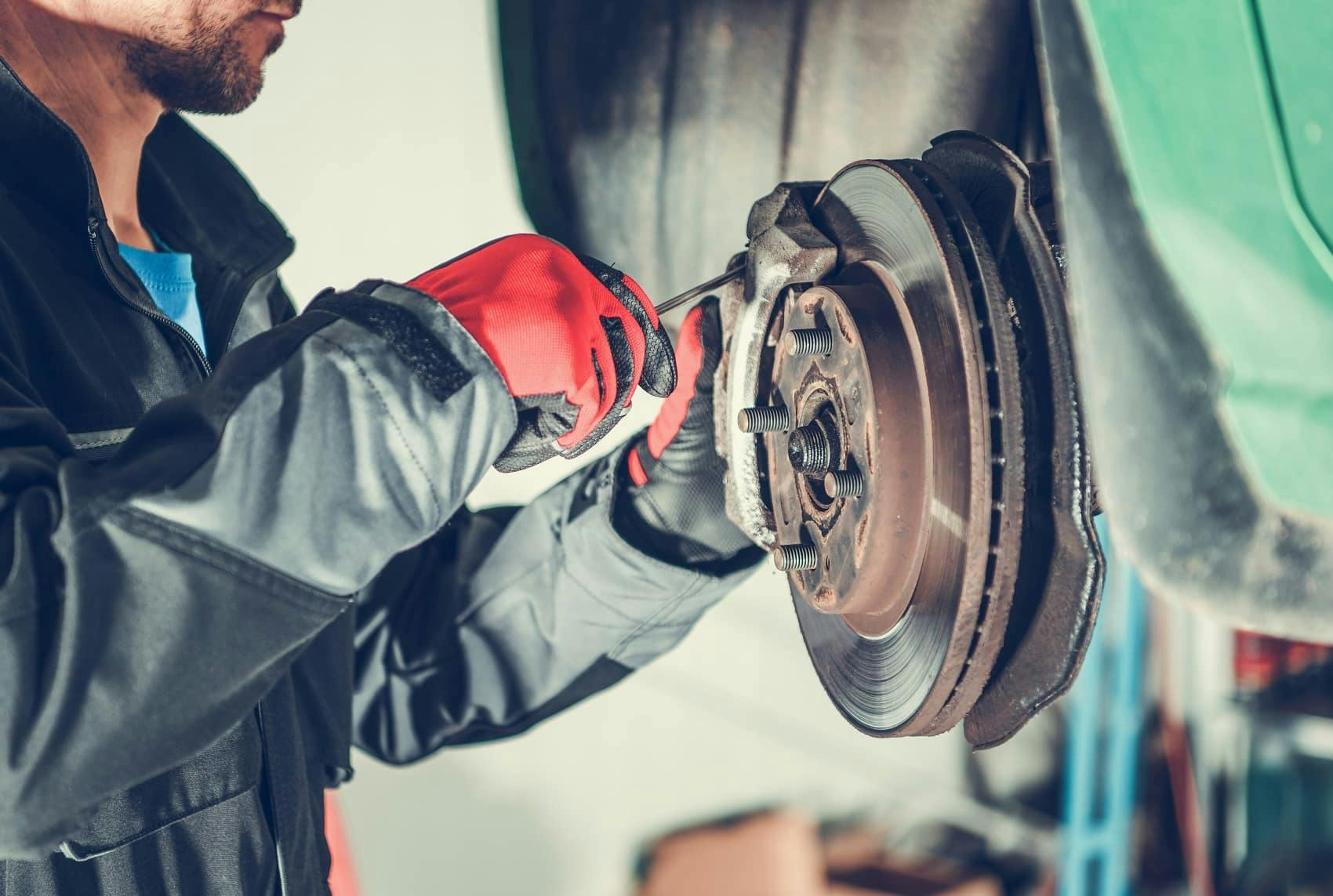 man working on brakes