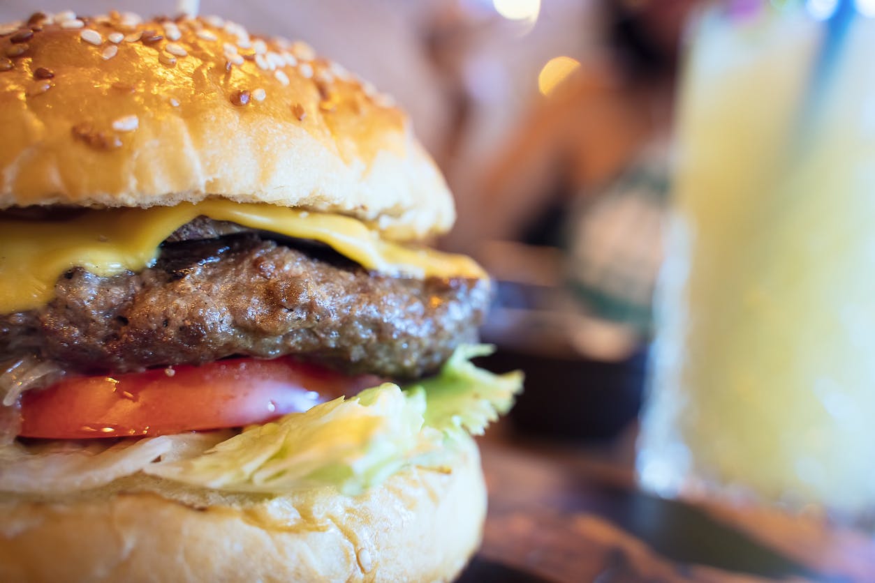 Take The Family Out To Ashton Avenue Family Restaurant Close-up of Cheeseburger in restaurant