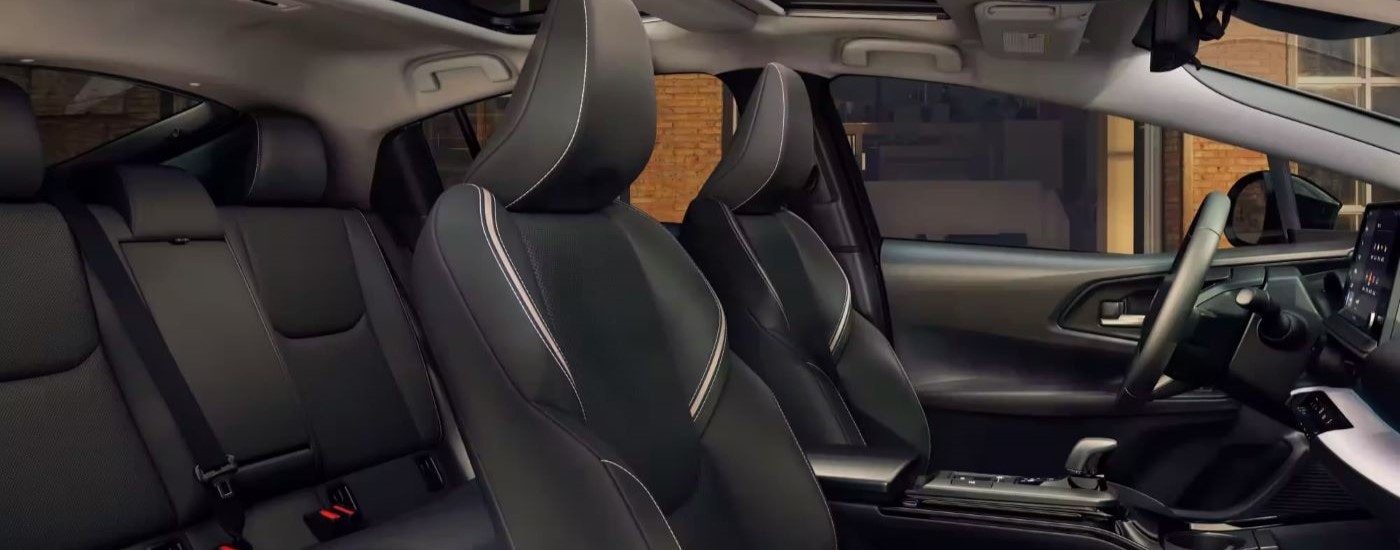 The black seats are shown in the interior of a 2023 Toyota Prius Limited.