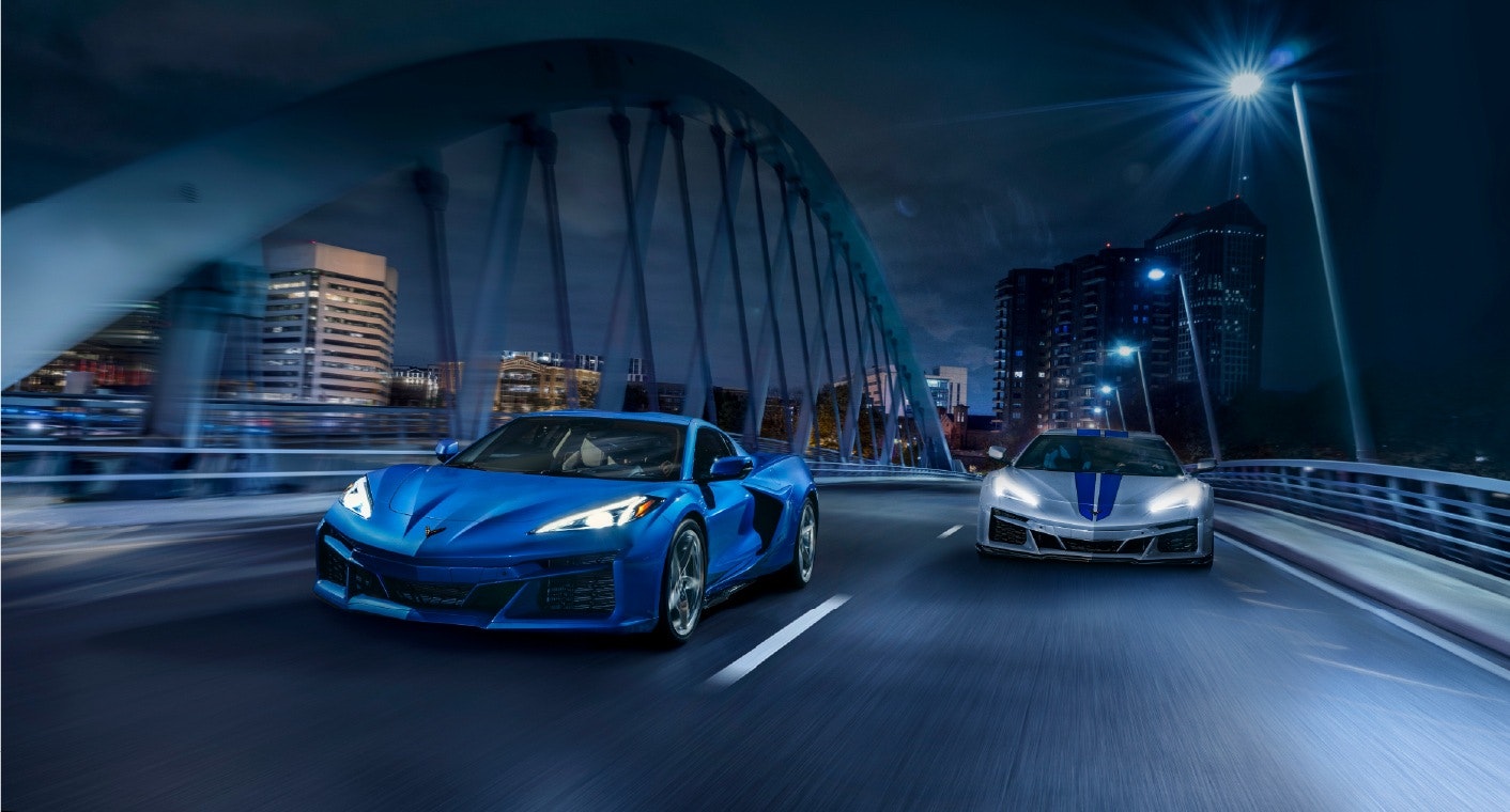 Corvette-E-Ray-Image-1 Two 2024 Corvette E-Rays driving together across a bridge