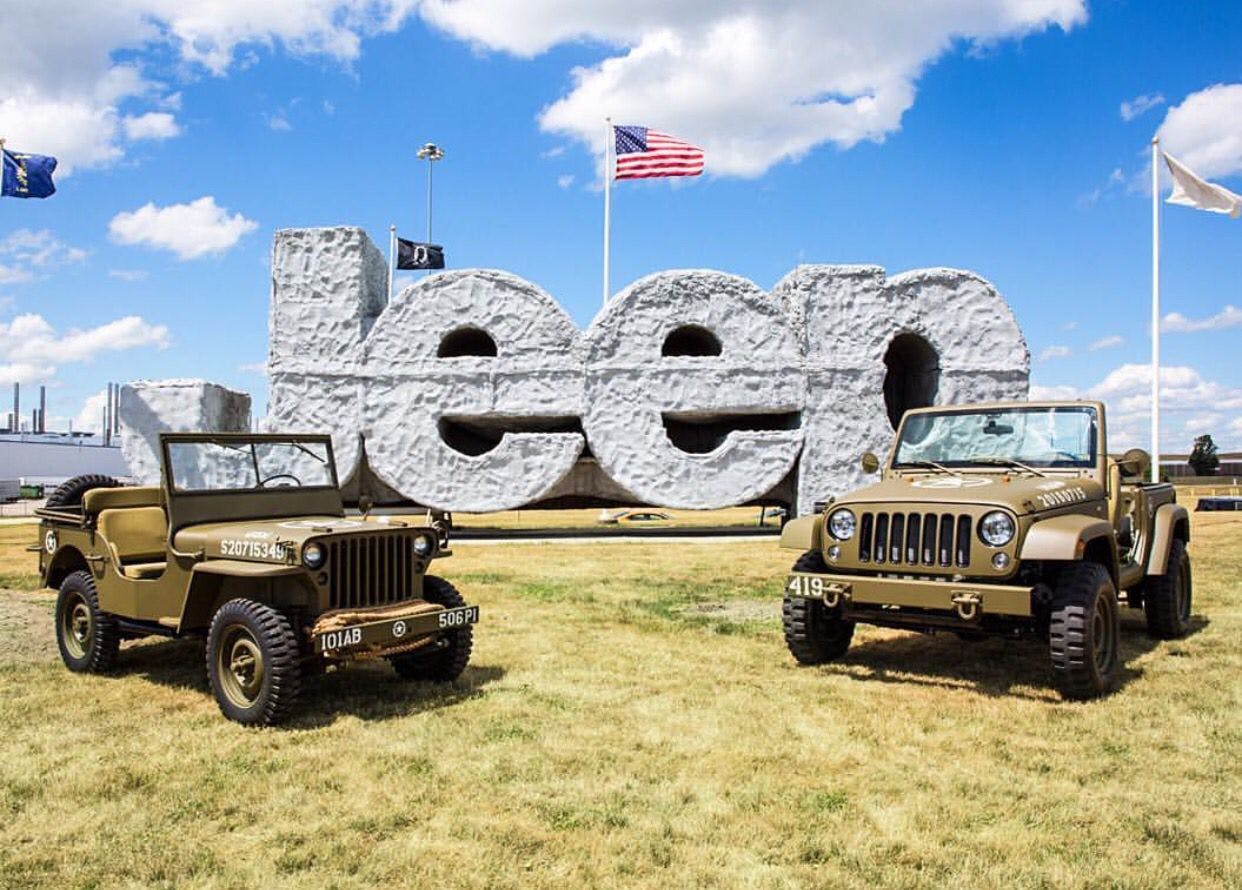 Army Jeeps in front of a Jeep sign