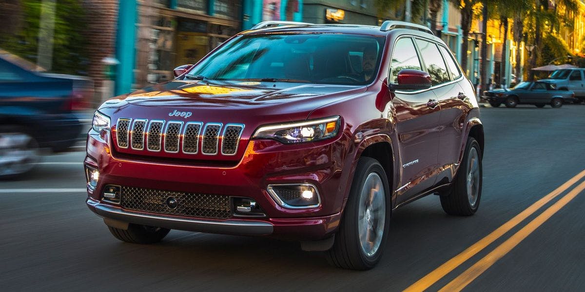 2023-jeep-cherokee- 2023 Jeep Cherokee driving through a town