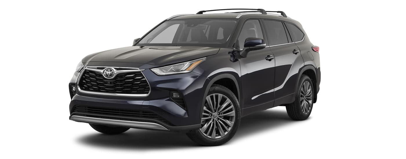 A dark grey 2023 Toyota Highlander Platinum is angled left.