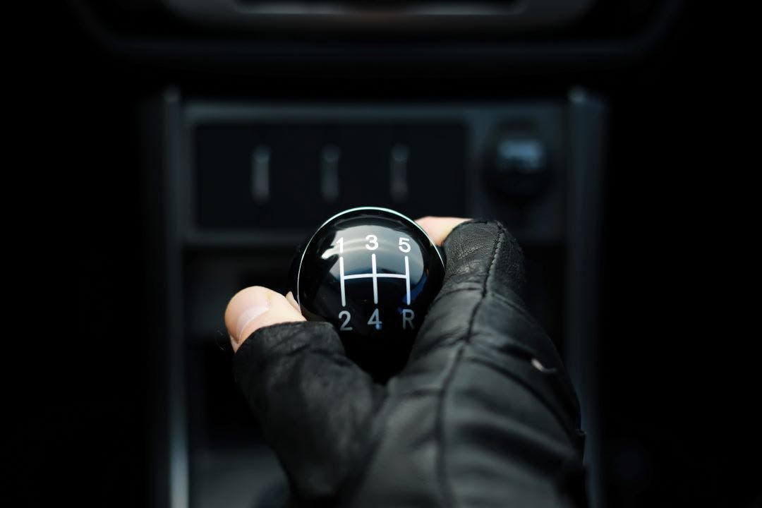 hand on a manual stick shift