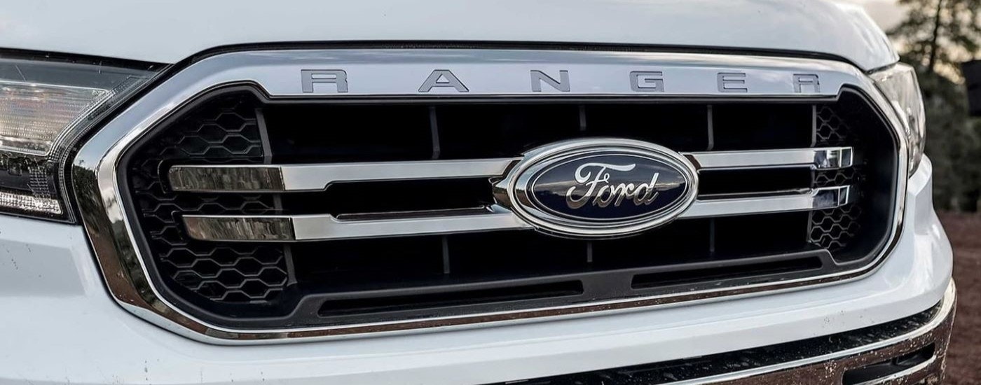 A close up shows the chrome grille on a white 2022 Ford Ranger.