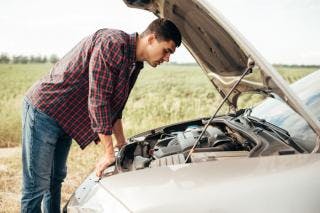 Man looking into engine bay