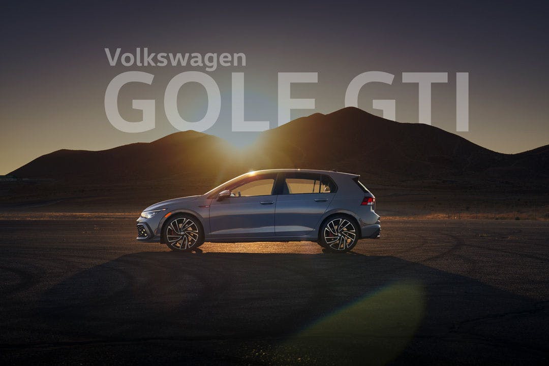 GolfGTI1 2024 VW Golf GTI S in front of mountains at sunset