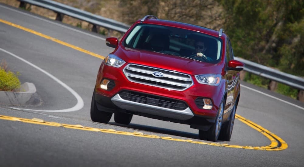 A red 2017 Ford Escape is shown from the front after leaving a dealer that offers bad credit car loans near Newport, NH.