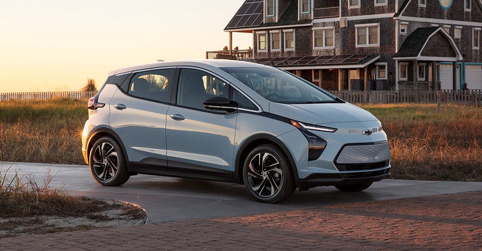 2023 Chevy Bolt EV parked by a beach house