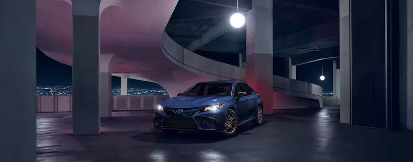 A blue 2023 Toyota Camry Nightshade is shown from the front at an angle.