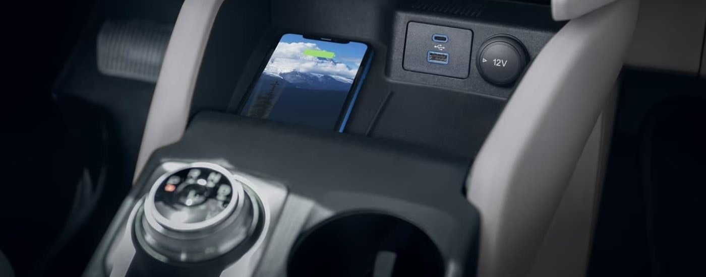 A phone is shown wirelessly charging in a 2024 Ford Escape.