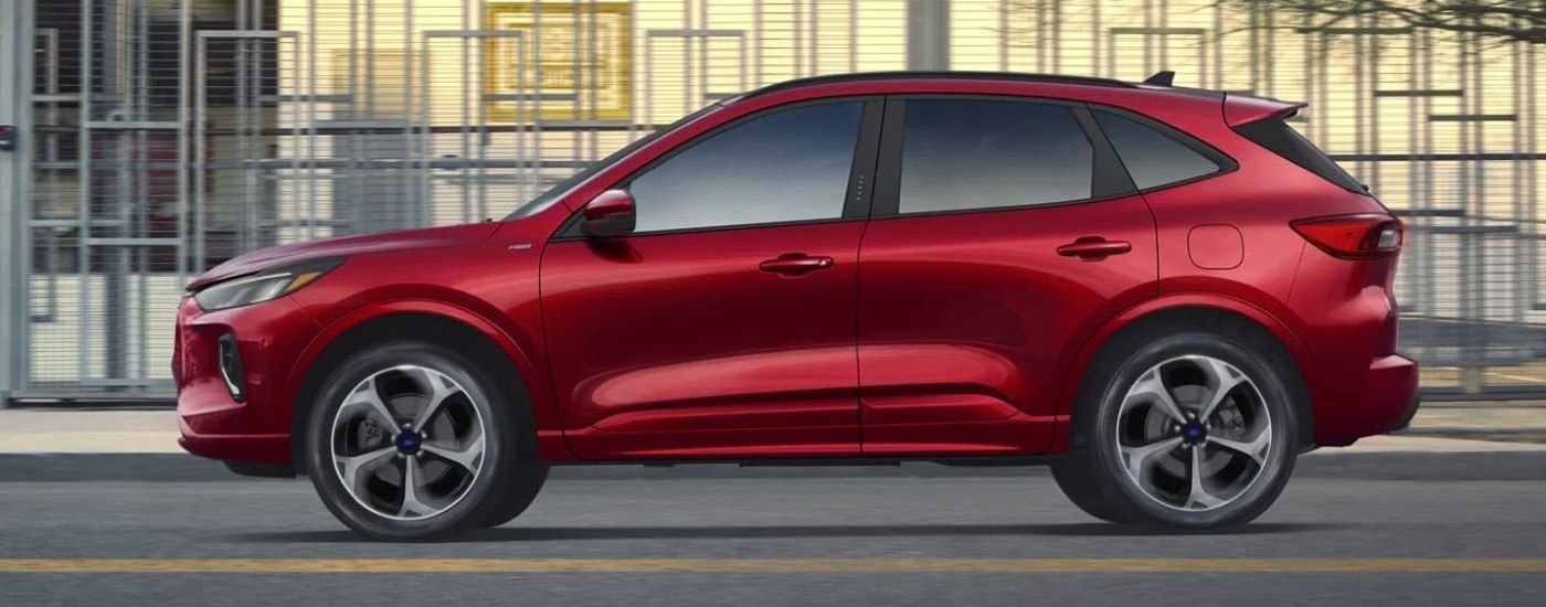 A red 2024 Ford Escape STLine is shown from the side.