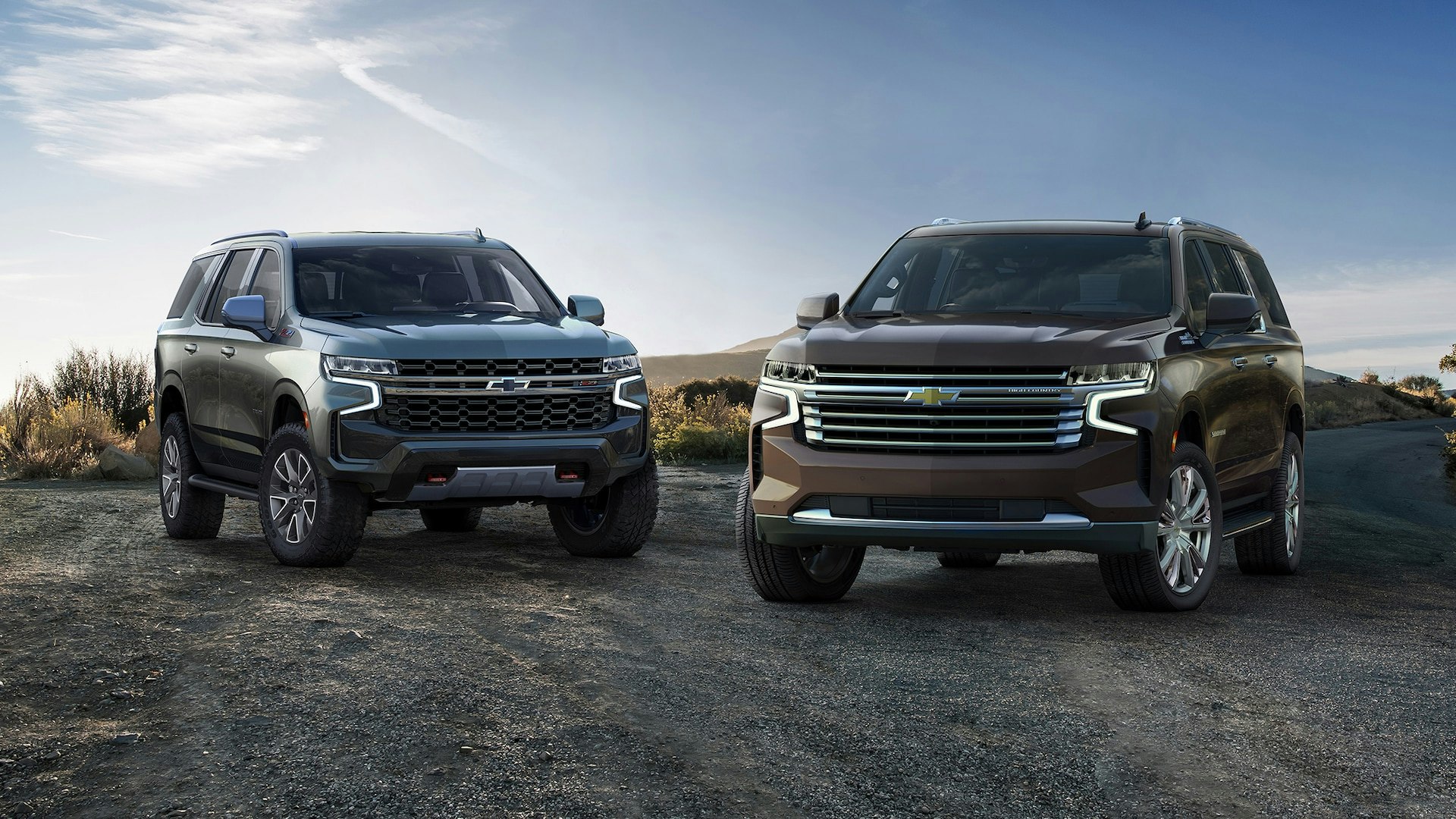 Chevrolet Tahoe and Suburban parked on a gravel road