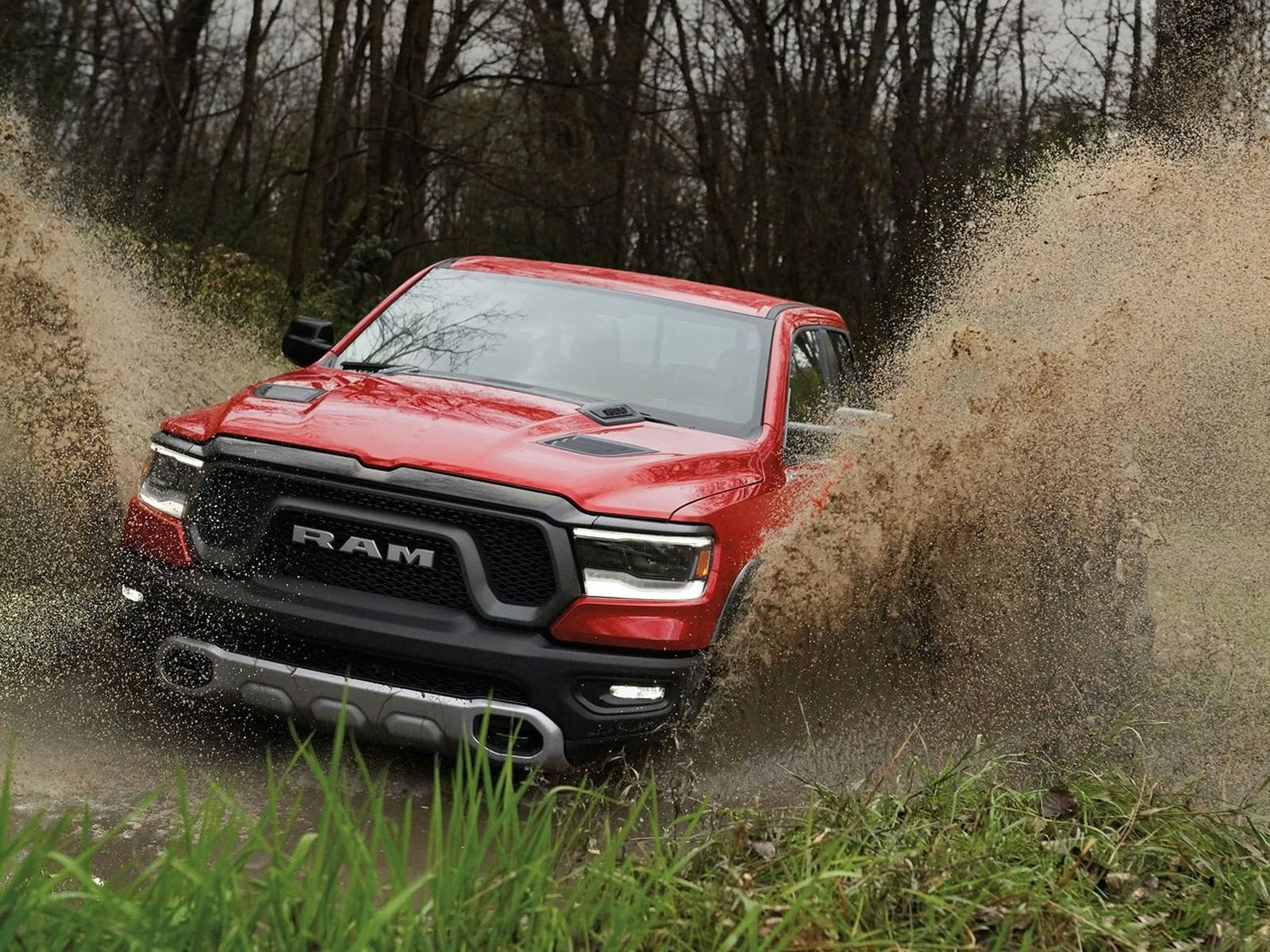 RAM 1500 Tradesman 2024 Ram 1500 Tradesman driving through a stream in the woods