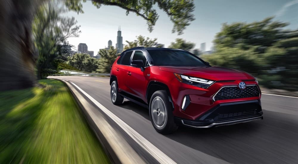 A red 2022 Toyota RAV4 Prime is shown from the front at an angle.