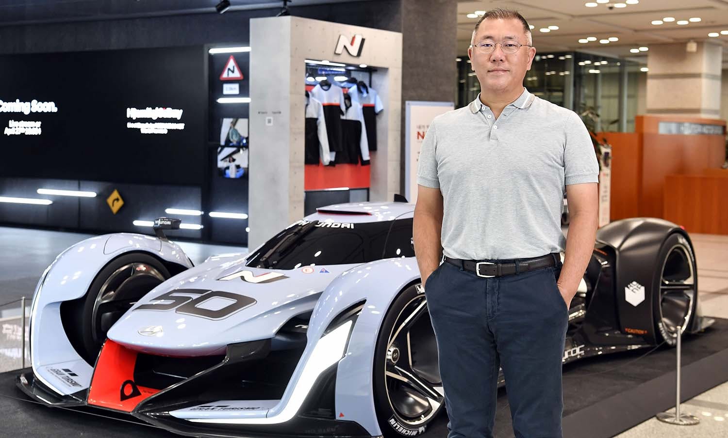 jeong-2 Euisun Chung in front of a Hyundai racecar