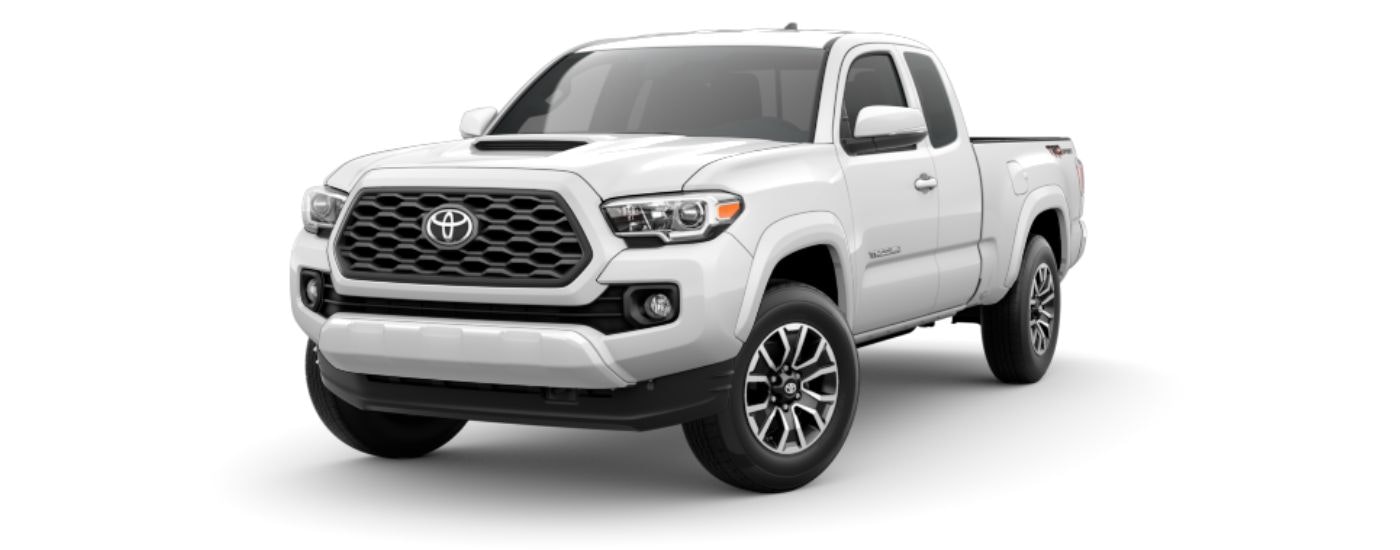 A white 2023 Toyota Tacoma TRD Sport is angled left.