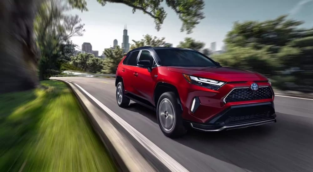 A red 2023 Toyota RAV4 Prime is shown from the front at an angle.