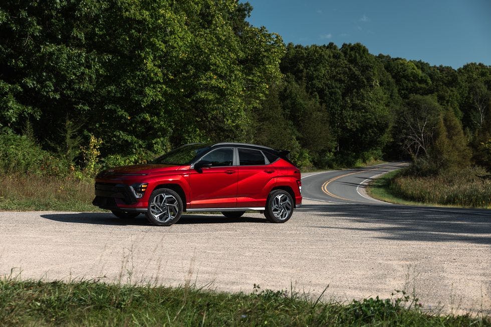2024-hyundai-kona-102-65490ac92ce9d 2024 Hyundai Kona parked on the side of a wooded road