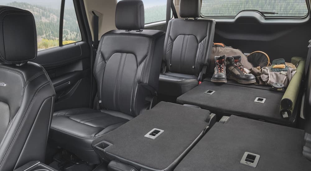 The interior of a 2024 Ford Expedition is shown from the front looking back.