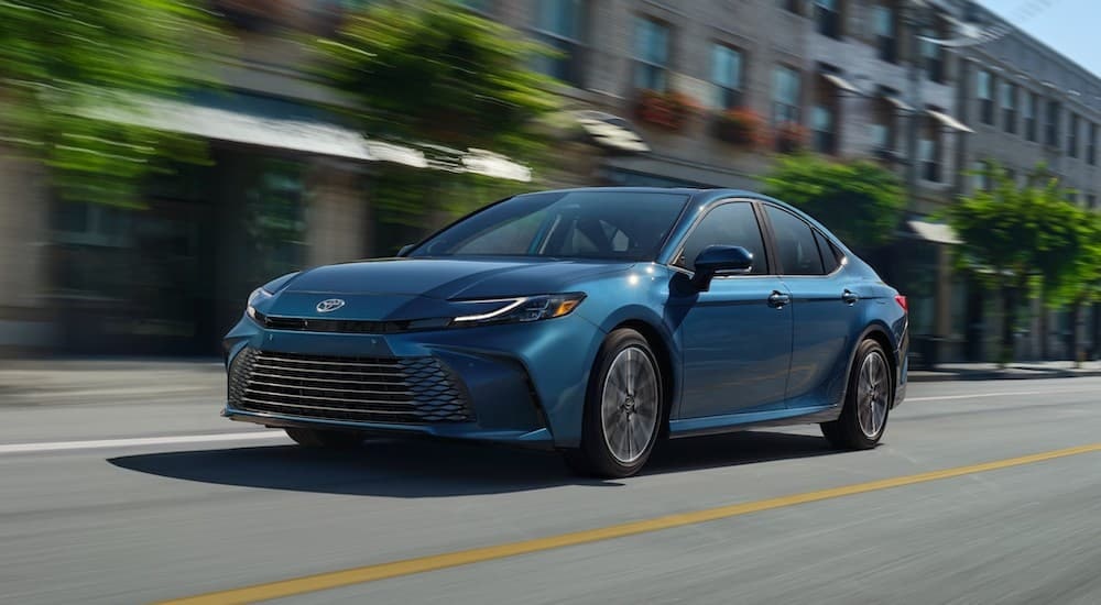 A blue 2025 Toyota Camry XSE is shown from the front at an angle.