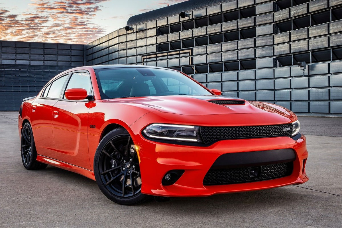 2023 Dodge Charger GT parked in front of an industrial building