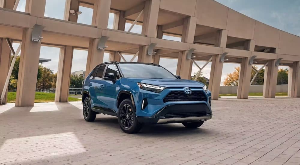 A blue 2024 Toyota RAV4 Prime is shown from the front at an angle.