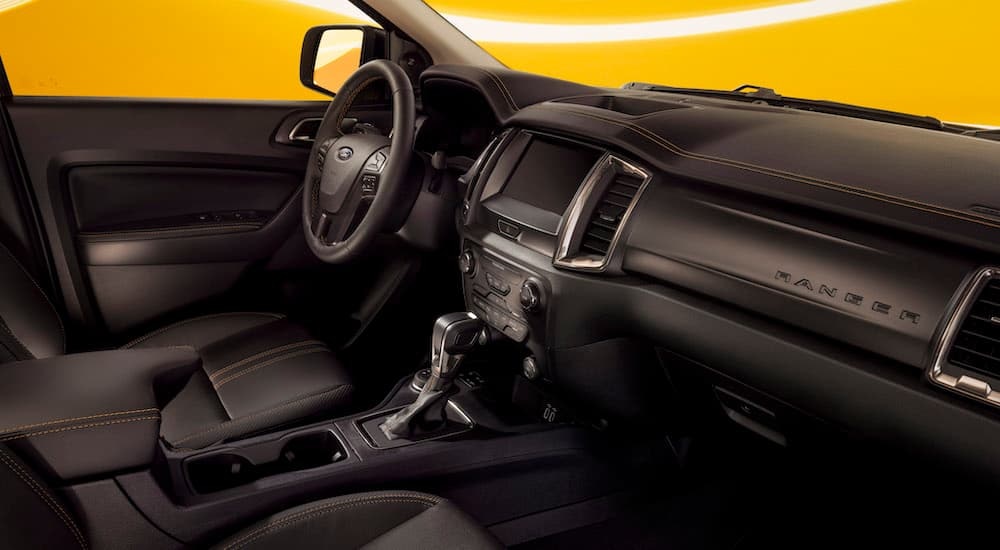 The black interior of a 2022 Ford Ranger Splash is shown from the passenger seat.
