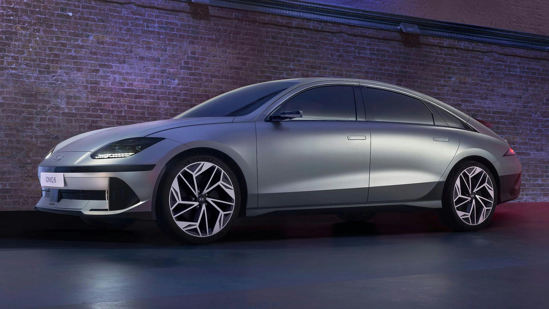 2024-Hyundai-Ioniq-6-Electric-Car-2 2024 Hyundai IONIQ 6 parked in front of a brick wall
