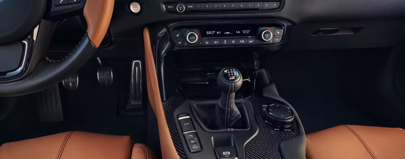 The tan and black interior is shown in a 2024 Toyota GR Supra.