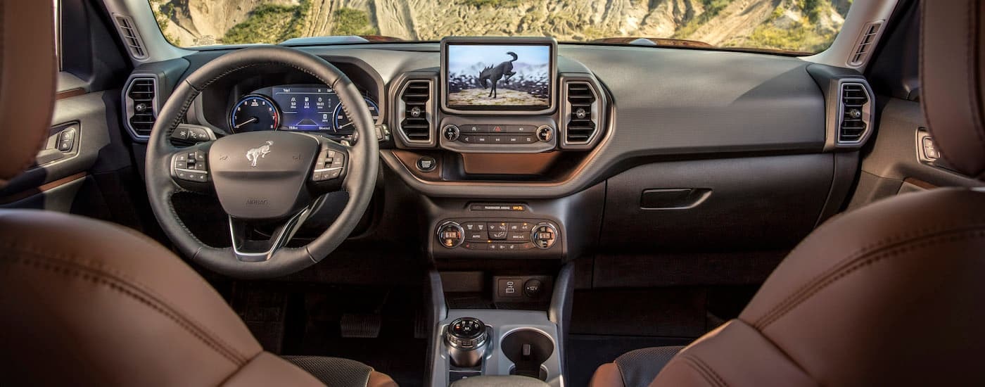 The brown interior of a 2022 Ford Bronco Sport is shown from above the center console.